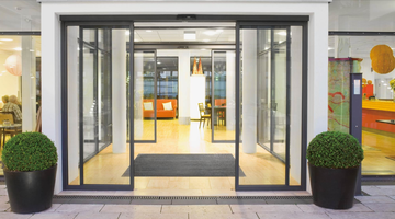 How to Achieve Seamless Integration Between Hotel Service Robots and Automatic Sensor Doors